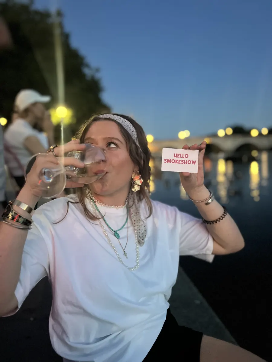 Someone holding up a Hello Smokeshow card