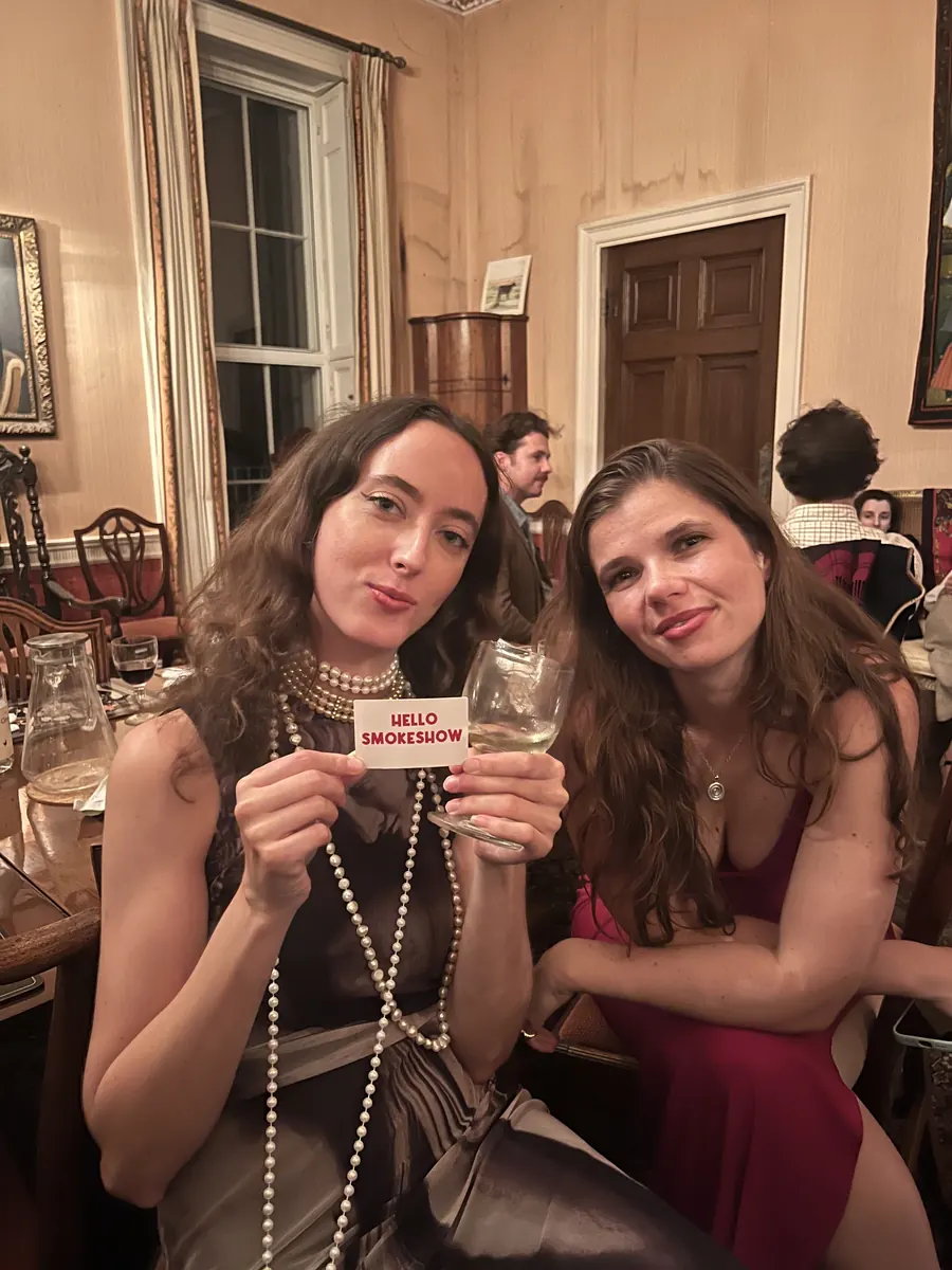 Someone holding up a Hello Smokeshow card